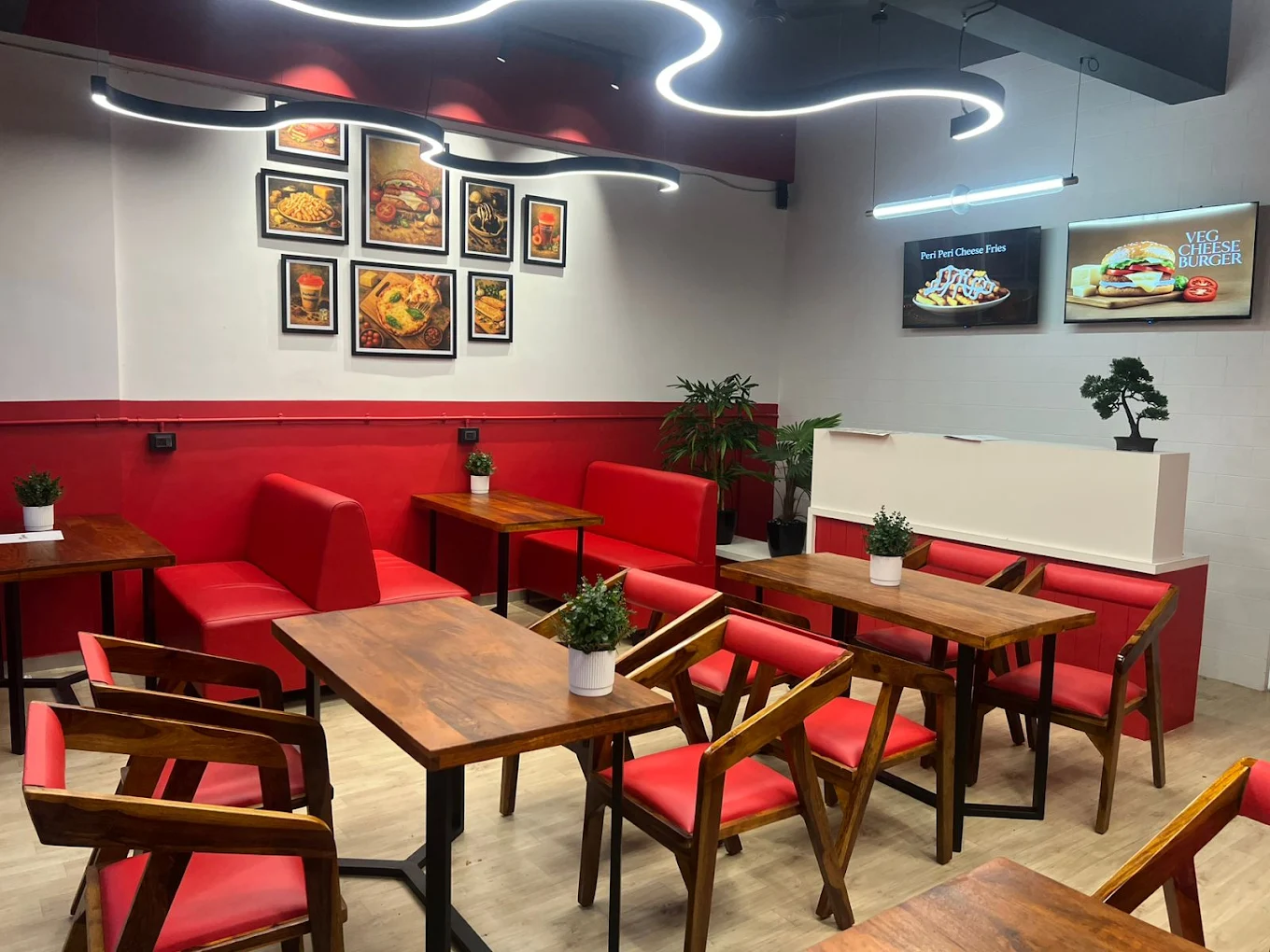 Real Bardoli café interior with red chairs and wooden tables